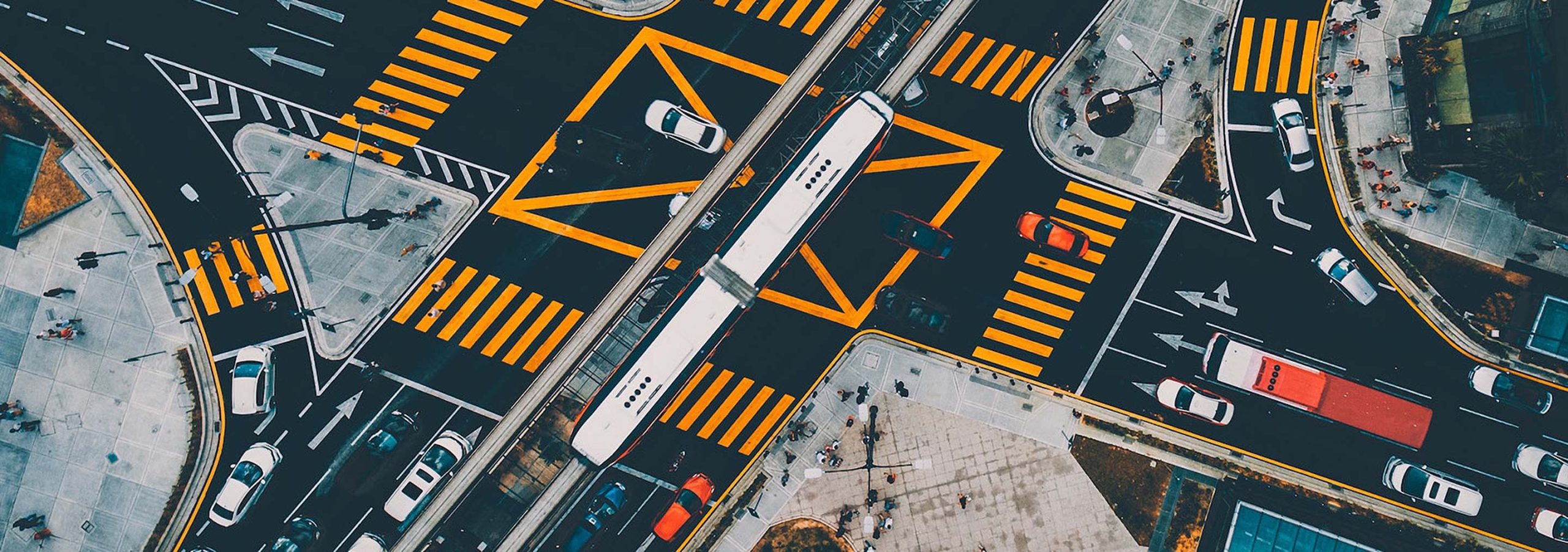 Kuala Lumpur crossroads with a train passing over the top